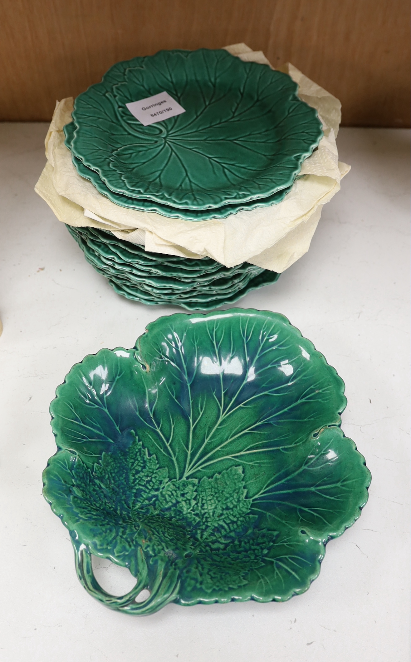 Sixteen Wedgwood green-glazed leaf plates and similar serving plate, latter 25cm